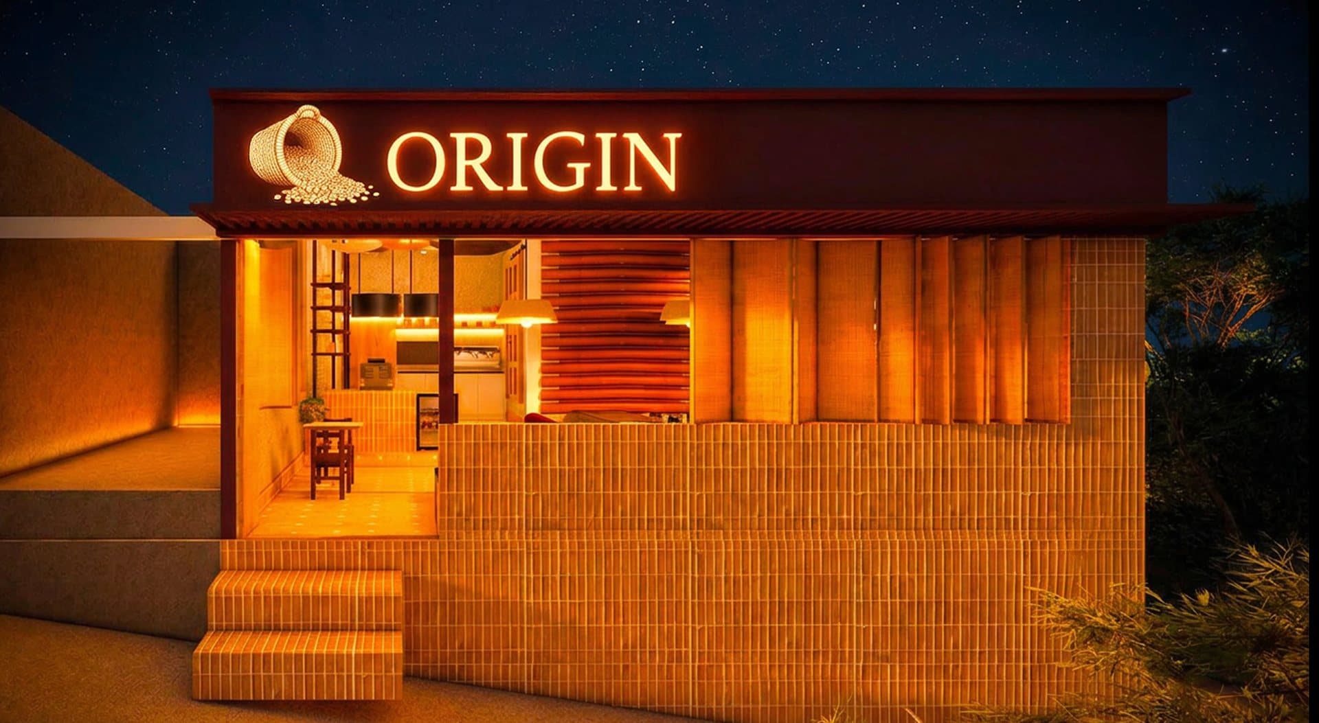 Fachada de Origin de noche